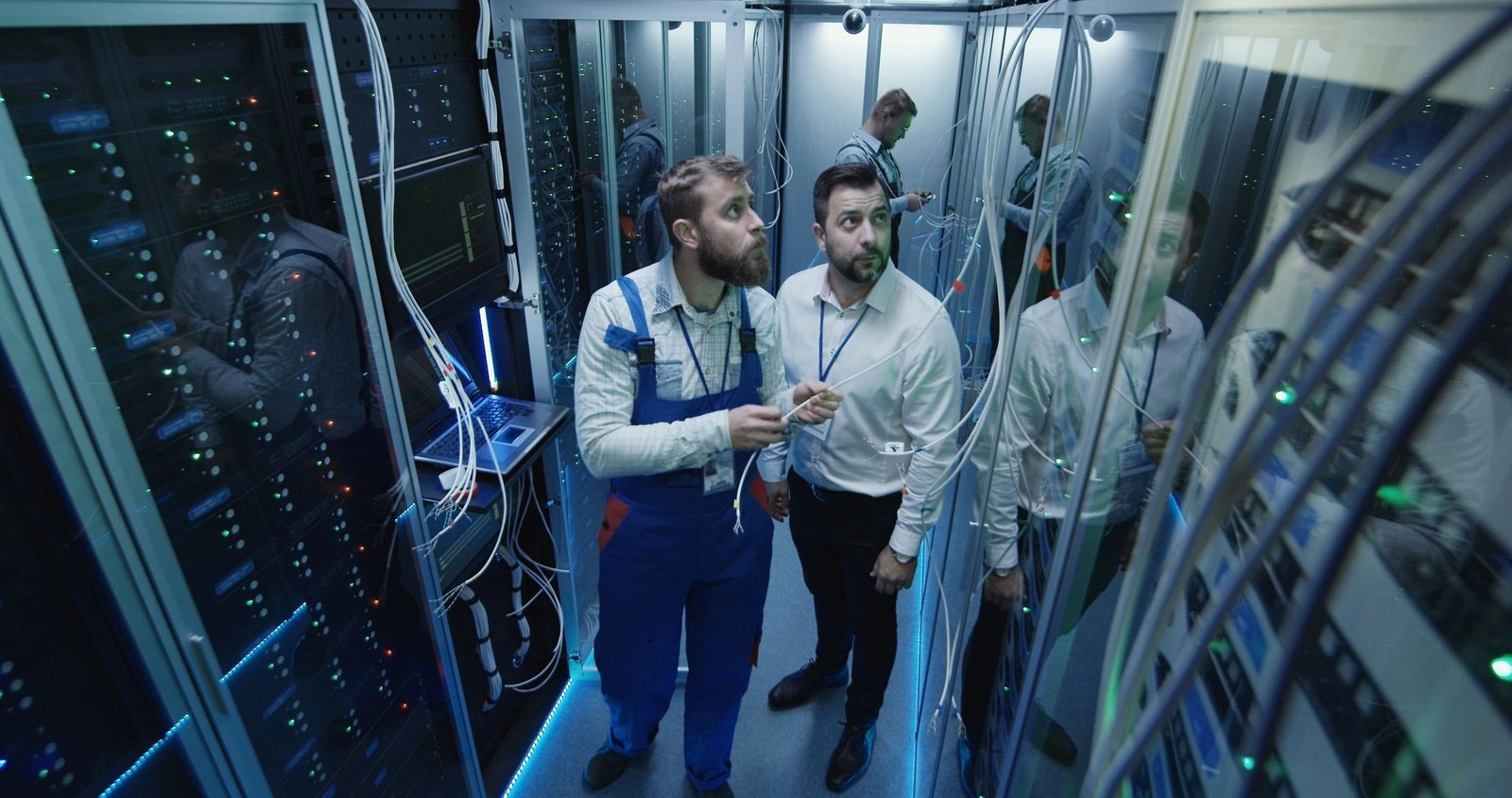 IT professionals working in a data center server room