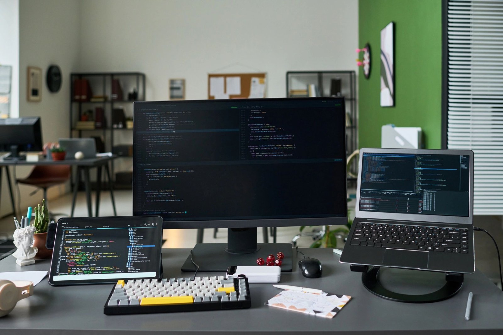 Software development workspace displaying code across multiple screens
